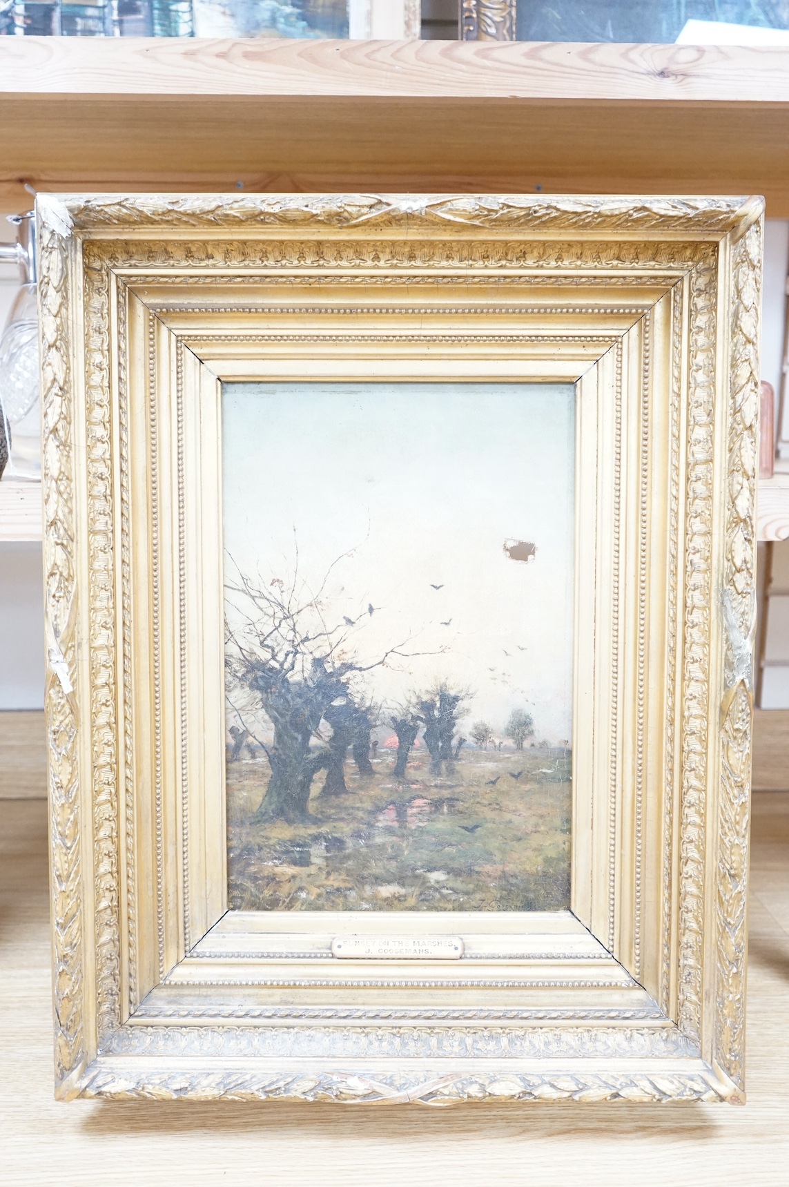 Joseph Theodore Coosemans (Belgian, 1828-1904), oil on canvas, ‘Sunset on the Marshes’, signed, labels verso, 42 x 27cm, ornately gilt framed. Condition - hole to the canvas